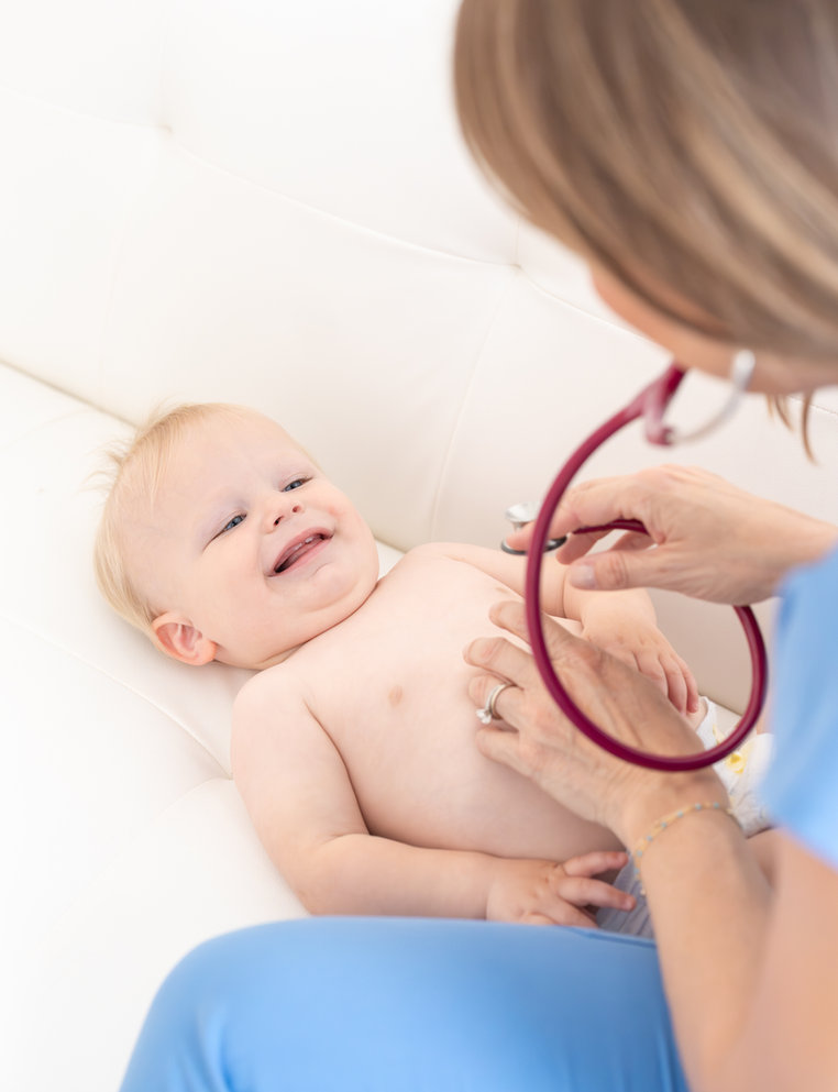 Dr. Lisa Hayes during an office visit with a young patient